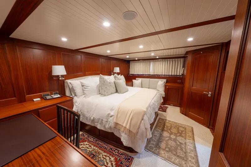Slide: The Image of Luxurious cabin interior of 2022 Hunt Yachts Ocean 76EP with elegant wood paneling. - 44