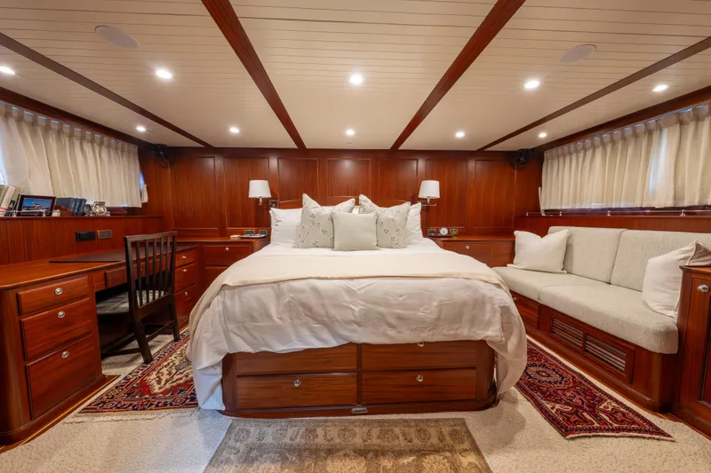 Slide: The Image of Luxurious bedroom interior of 2022 Hunt Yachts Ocean 76EP with wood paneling and elegant furnishings. - 46