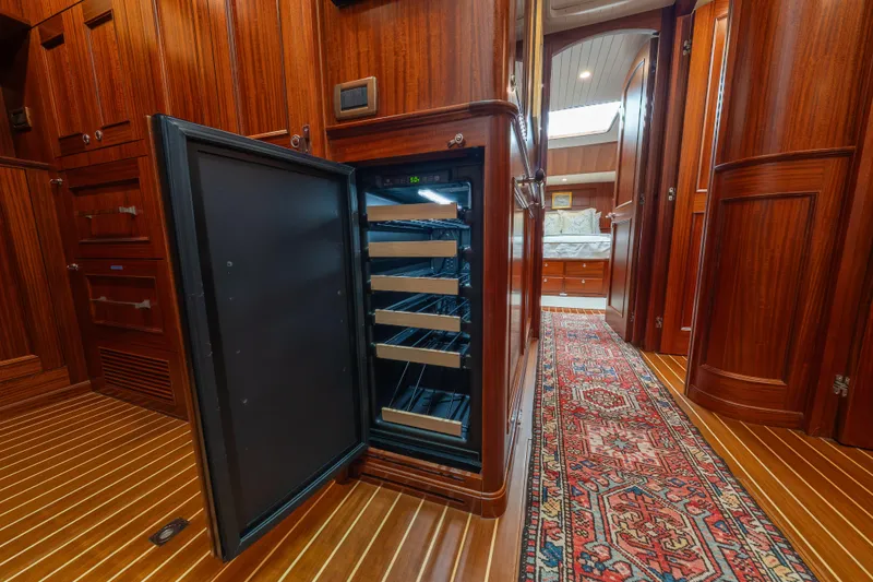 Slide: The Image of Luxurious interior of 2022 Hunt Ocean 76EP yacht with open wine cooler. - 49