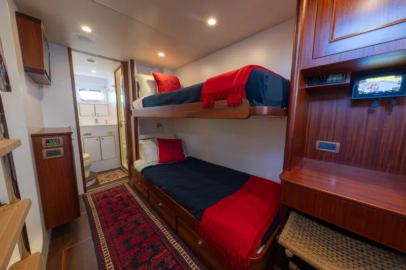 Slide: The Image of Luxurious cabin interior of 2022 Hunt Ocean 76EP yacht with bunk beds and ensuite bathroom. - 50