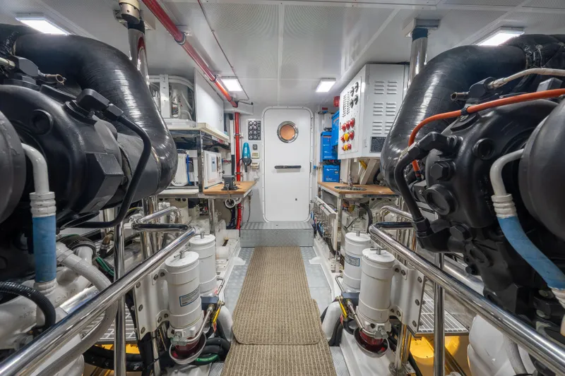 Slide: The Image of Engine room of 2022 Hunt Yachts Hunt Ocean 76EP, showcasing advanced marine machinery. - 54