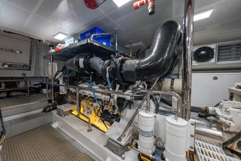 Slide: The Image of Engine room of 2022 Hunt Yachts Hunt Ocean 76EP, showcasing advanced machinery and equipment. - 56