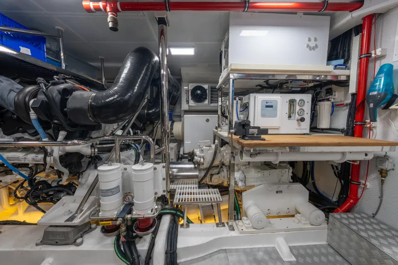 Slide: The Image of Engine room of 2022 Hunt Yachts Hunt Ocean 76EP, showcasing advanced machinery and equipment. - 57