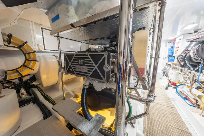 Slide: The Image of Engine room of 2022 Hunt Yachts Hunt Ocean 76EP, featuring CAT marine power system. - 58