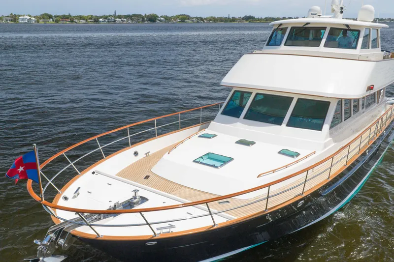 Slide: The Image of 2022 Hunt Yachts Ocean 76EP cruising on open water, showcasing sleek design and luxury features. - 6