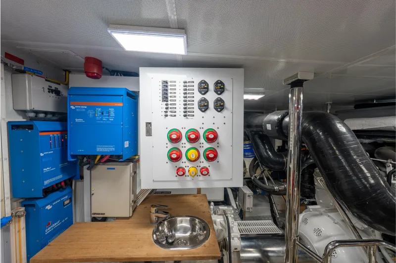 Slide: The Image of Engine room of 2022 Hunt Yachts Ocean 76EP with control panel and equipment. - 60