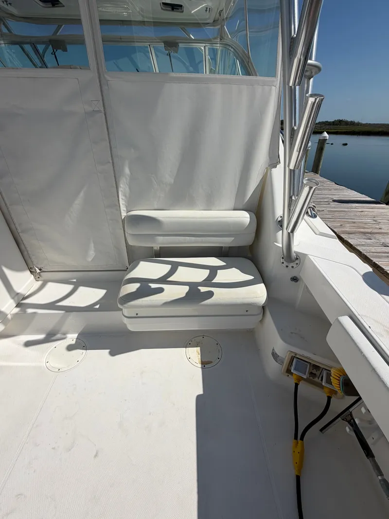 Slide: The Image of Interior of a 2005 Rampage 33 Express boat at the dock. - 15