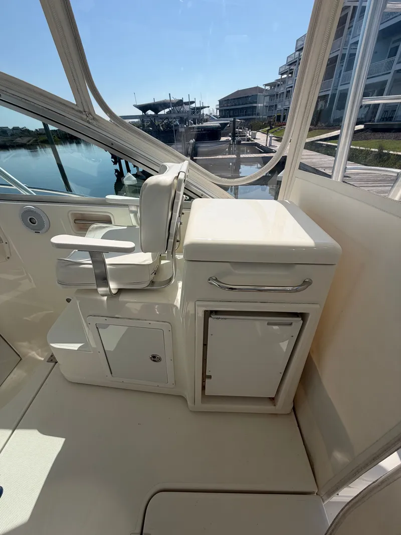 Slide: The Image of Interior of a 2005 Rampage 33 Express boat with seating and storage. - 17