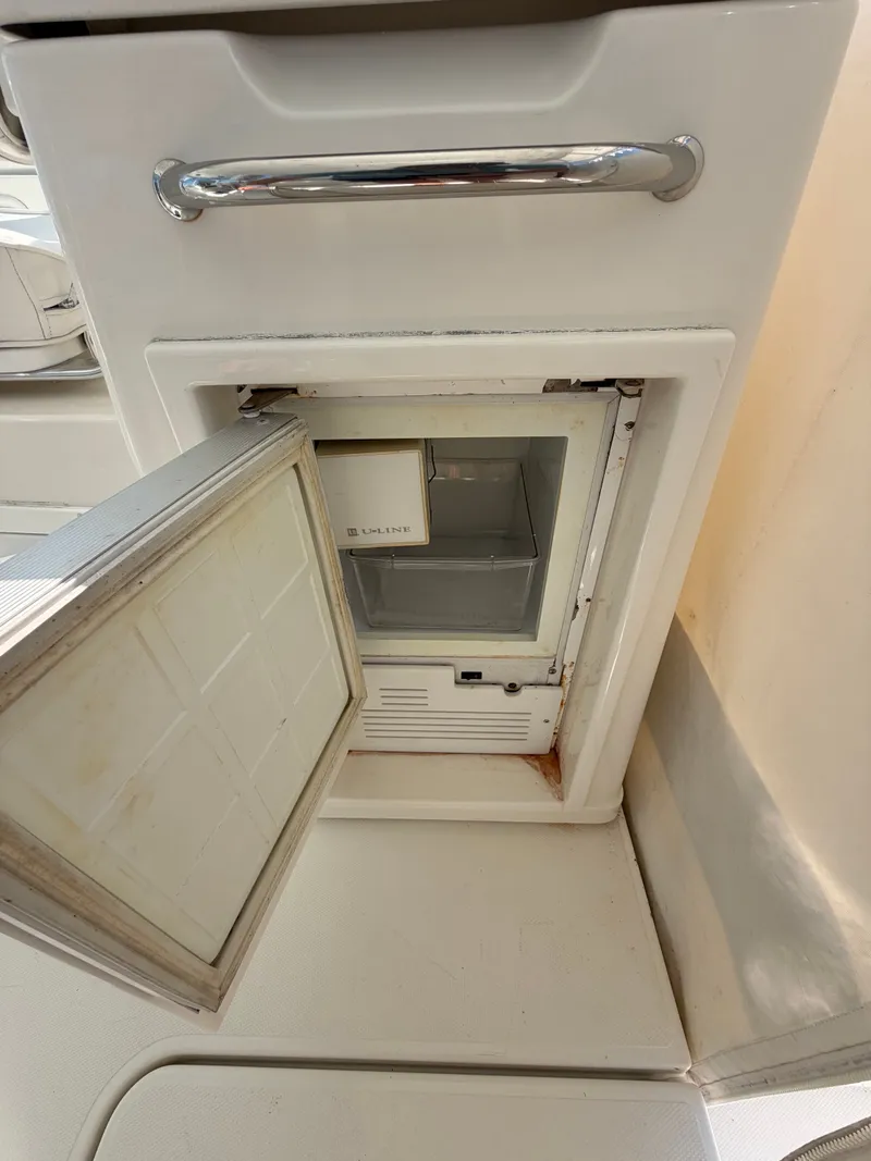 Slide: The Image of Open fridge on a 2005 Rampage 33 Express boat. - 19