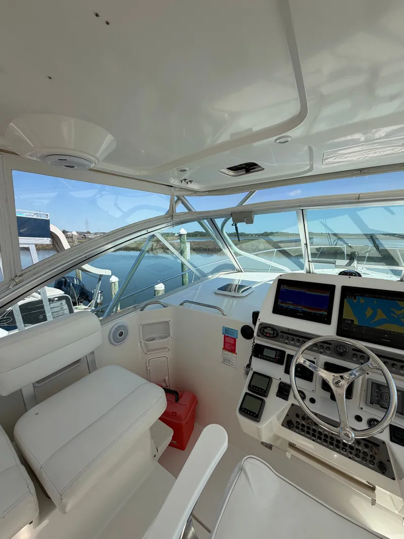 Slide: The Image of Interior of 2005 Rampage 33 Express with helm console. - 26