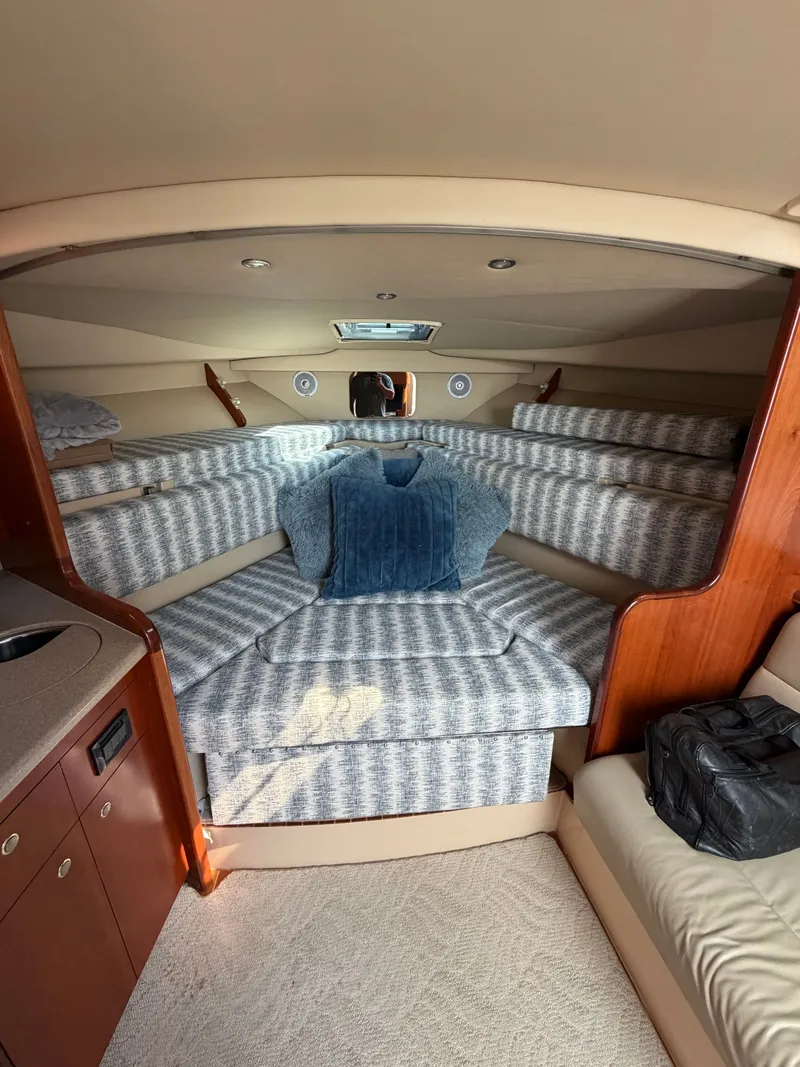 Slide: The Image of Interior of a 2005 Rampage 33 Express yacht with cozy sleeping area. - 29