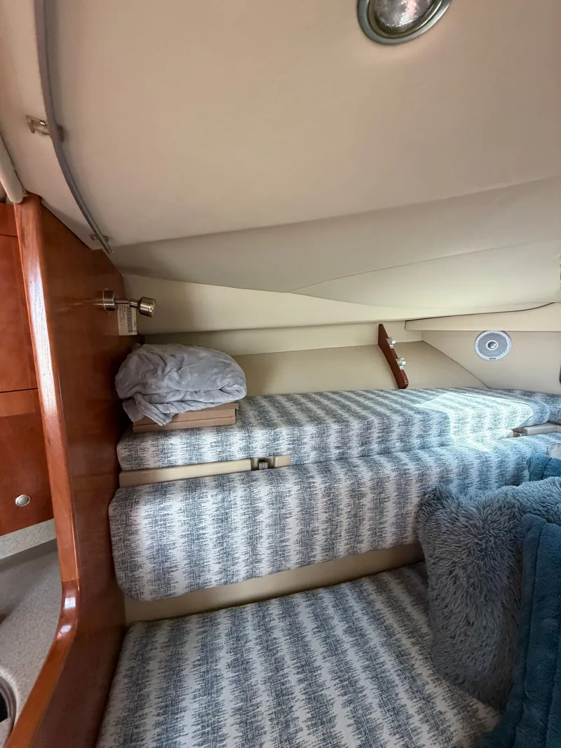 Slide: The Image of Interior of a 2005 Rampage 33 Express yacht with cozy bedding. - 35