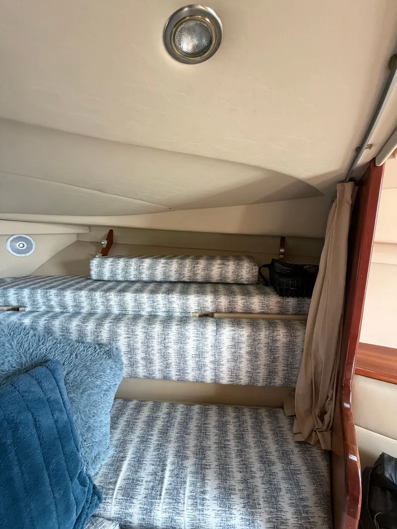 Slide: The Image of Interior of 2005 Rampage 33 Express with cozy bedding. - 36