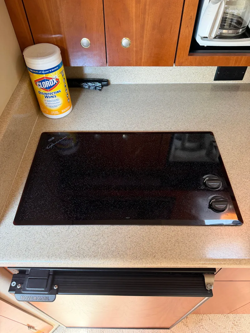Slide: The Image of Kitchen area in a 2005 Rampage 33 Express boat. - 41