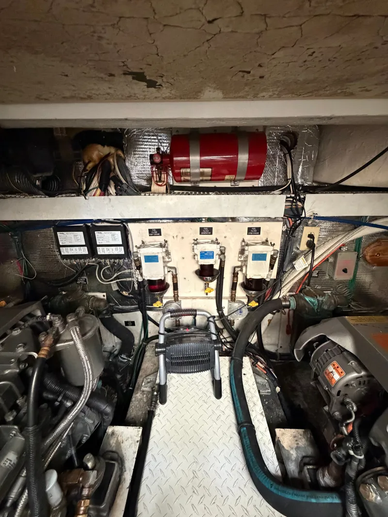 Slide: The Image of Engine room of 2005 Rampage 33 Express with machinery and wiring. - 48