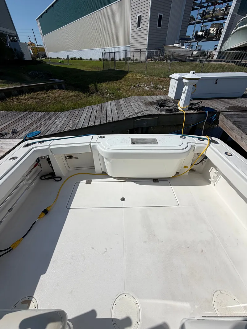 Slide: The Image of Interior of a 2005 Rampage 33 Express boat at dock. - 5