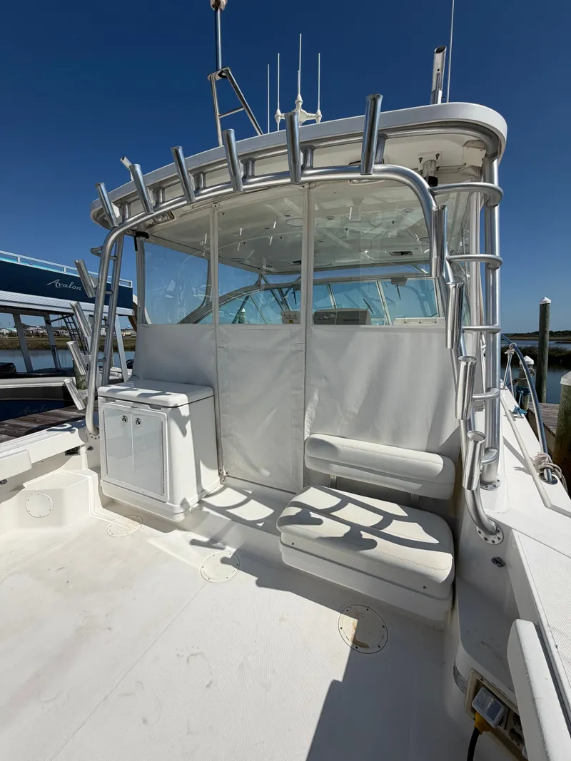 Slide: The Image of 2005 Rampage 33 Express boat with spacious deck and seating area. - 6