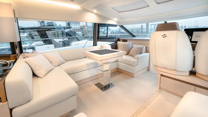 Slide: The Image of Luxurious interior of 2023 Prestige 520S yacht with elegant seating and modern design. - 12