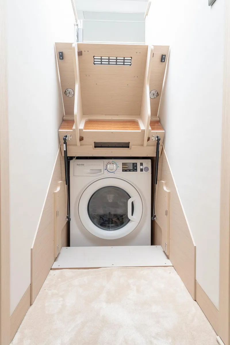 Slide: The Image of 2023 Prestige 520S laundry area with built-in washing machine in compact space. - 22