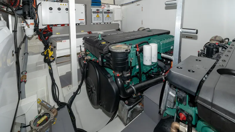 Slide: The Image of Engine room of 2023 Prestige 520S yacht, showcasing advanced machinery and components. - 28