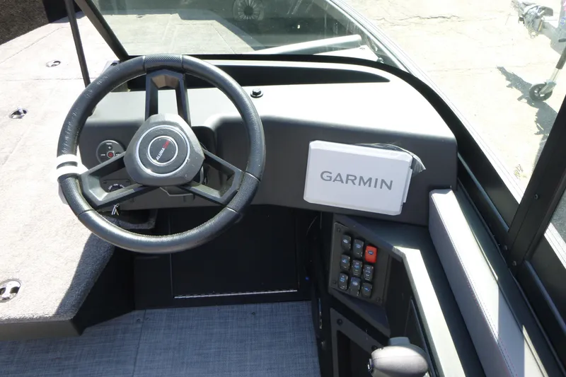 Slide: The Image of 2025 Alumacraft Trophy 175X Sport dashboard with Garmin navigation system. - 12