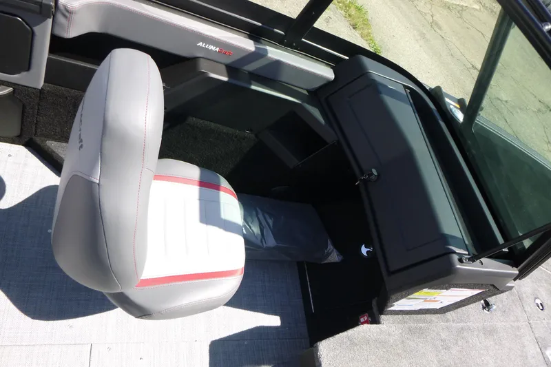 Slide: The Image of Interior of 2025 Alumacraft Trophy 175X Sport boat, featuring a sleek seat and dashboard. - 13