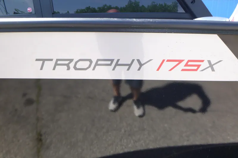 Slide: The Image of 2025 Alumacraft Trophy 175X Sport boat decal on a reflective surface. - 17