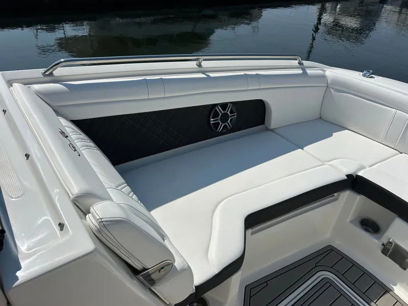 Slide: The Image of The 2027 Sea Ray SDX 290 Outboard features a spacious, cushioned seating area with sleek detailing. - 25
