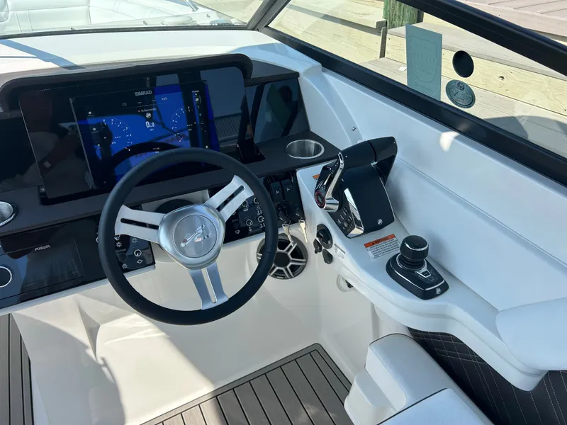 Slide: The Image of The image shows the helm of a 2027 Sea Ray SDX 290 Outboard with modern instruments. - 20
