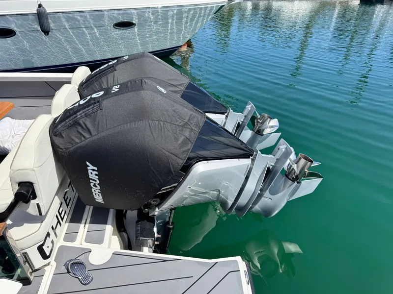 Slide: The Image of dual 300 HP V8 Mercury motors with storage covers - 7