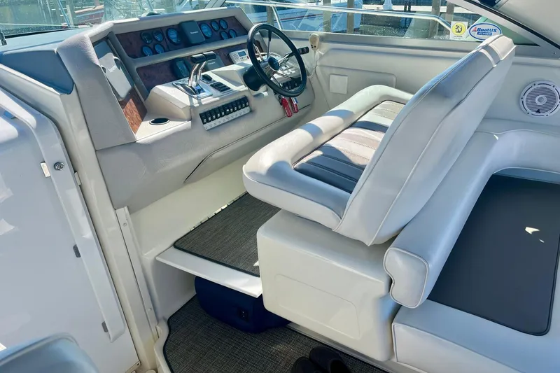 Slide: The Image of Interior helm of 1994 Sea Ray 370 Express Cruiser with steering wheel and controls. - 16