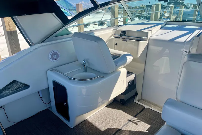 Slide: The Image of 1994 Sea Ray 370 Express Cruiser cockpit with helm seat and control panel. - 17