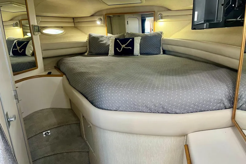 Slide: The Image of Luxurious cabin interior of 1994 Sea Ray 370 Express Cruiser with cozy bedding. - 24