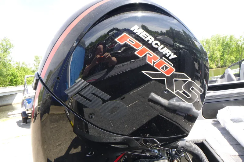 Slide: The Image of Mercury Pro XS engine on 2025 Alumacraft Trophy 185X Sport boat, outdoors. - 16