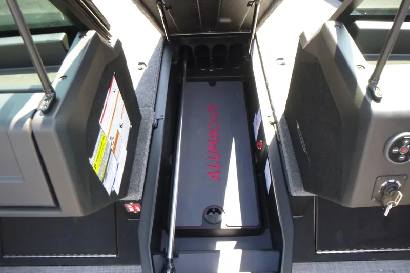 Slide: The Image of 2025 Alumacraft Trophy 185X Sport boat storage compartment with Alumacraft branding. - 8
