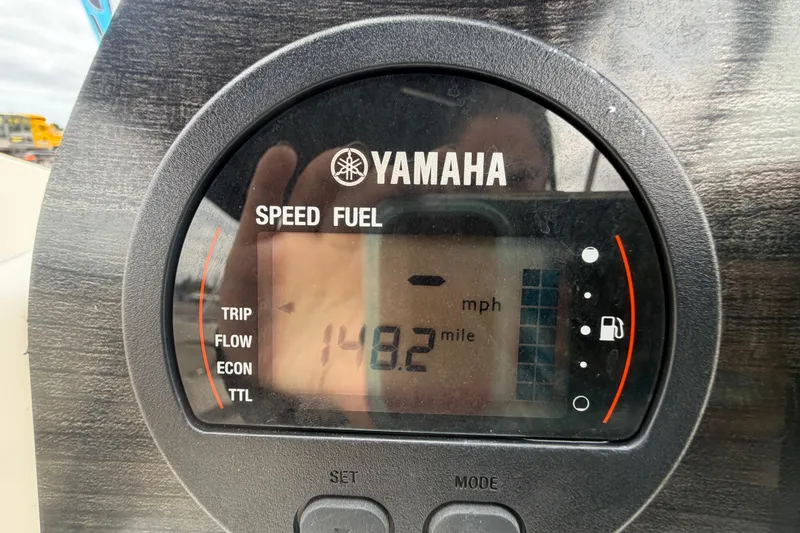 Slide: The Image of Yamaha speed and fuel gauge on 2023 Stingray 231 DC boat dashboard. - 22