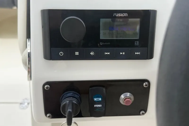 Slide: The Image of Fusion stereo system on 2023 Stingray 231 DC boat dashboard. - 25