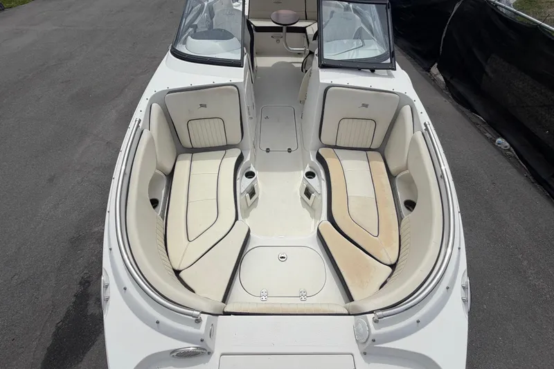 Slide: The Image of 2023 Stingray 231 DC boat interior with spacious seating and cup holders. - 42