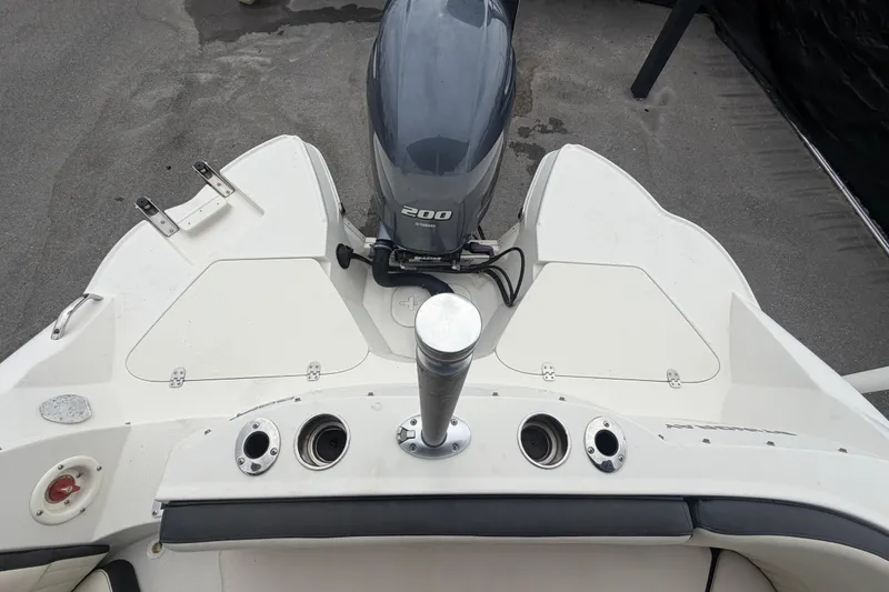 Slide: The Image of 2023 Stingray 231 DC boat with Yamaha 200 engine, rear deck view. - 61