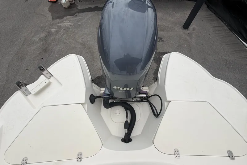 Slide: The Image of 2023 Stingray 231 DC boat with Yamaha 200 engine, rear view. - 66