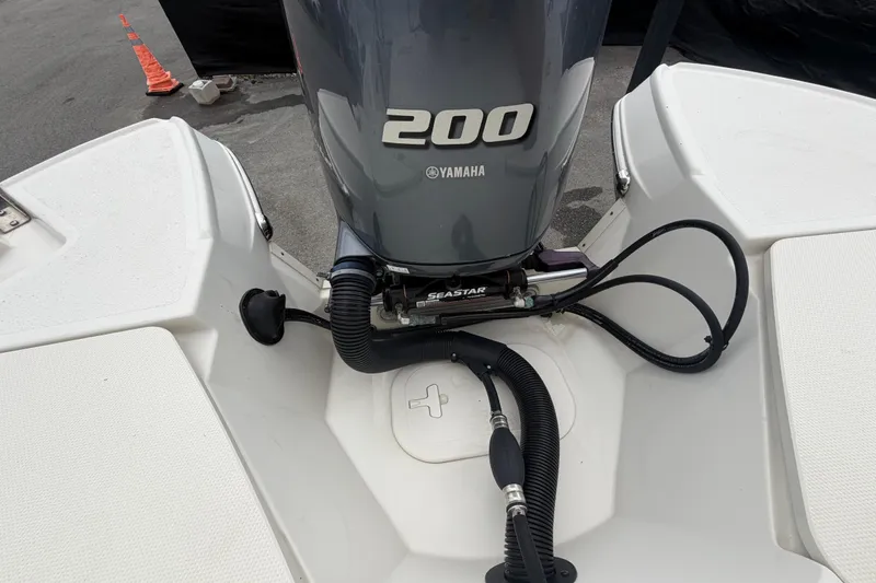 Slide: The Image of 2023 Stingray 231 DC boat with Yamaha 200 engine and SeaStar hydraulic steering. - 67