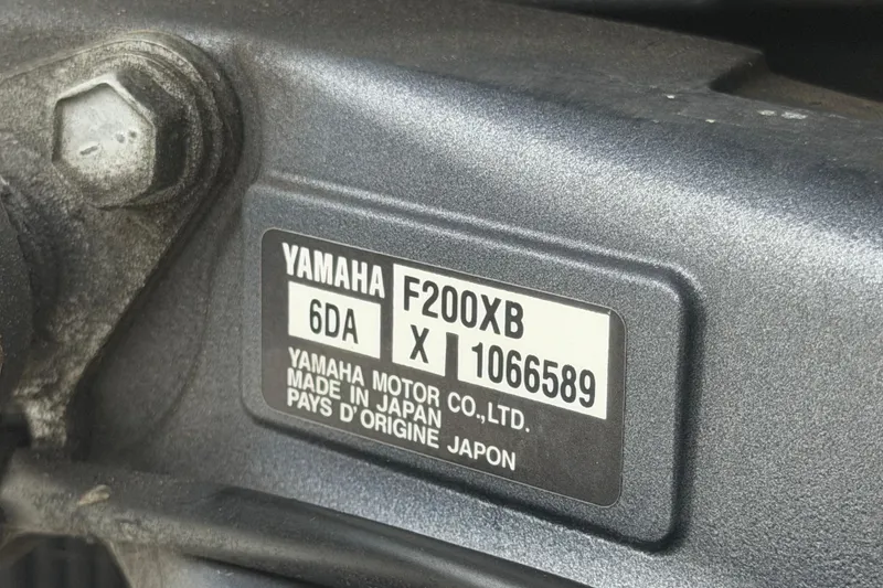 Slide: The Image of Yamaha F200XB engine label on 2023 Stingray 231 DC boat, made in Japan. - 68