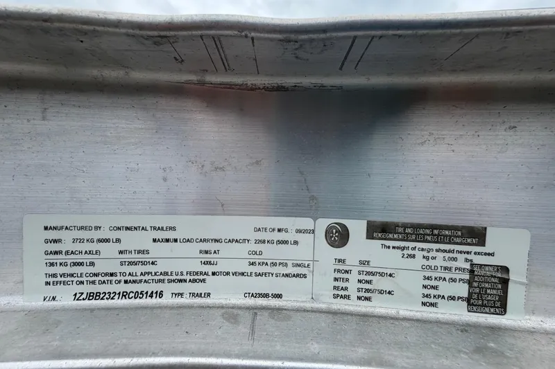 Slide: The Image of Trailer specification label showing weight limits and tire information, manufactured by Continental Trailers. - 70