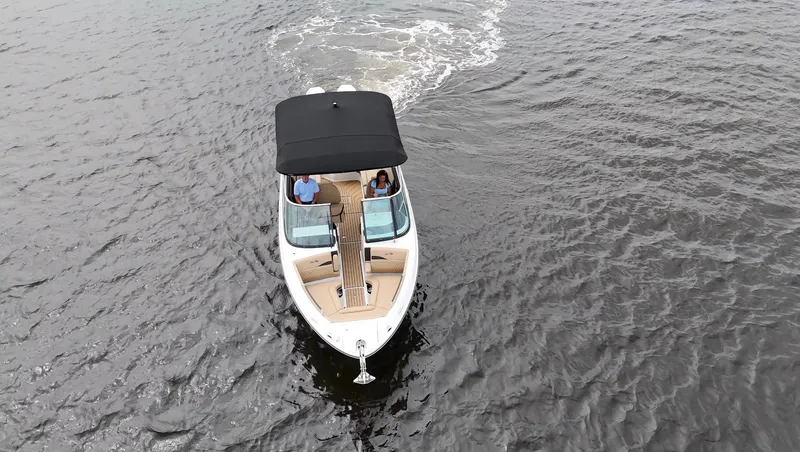 Slide: The Image of Aerial view of a Sea Ray SLX 280 Outboard on the water with two people on board. - 6