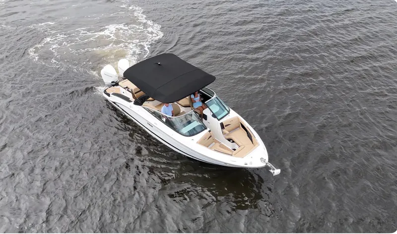 Slide: The Image of Aerial view of a Sea Ray SLX 280 Outboard on the water with a black sunshade. - 10