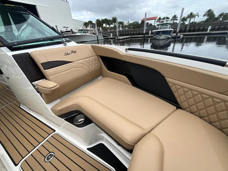 Slide: The Image of The image shows the luxurious cockpit of a 2027 Sea Ray SLX 280 Outboard with elegant beige upholstery. - 27