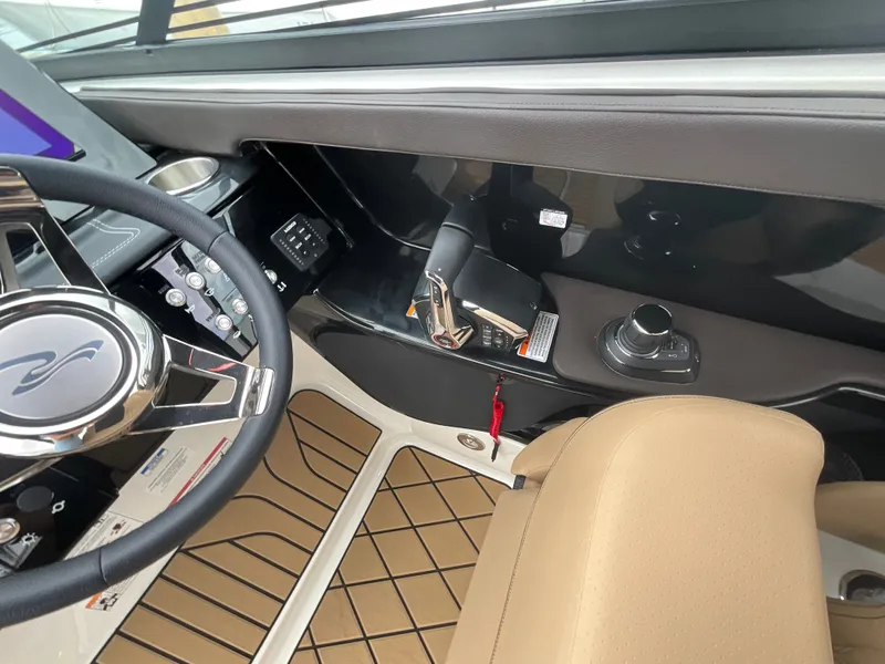 Slide: The Image of Interior view of a 2027 Sea Ray SLX 280 Outboard with modern helm and beige seating. - 22
