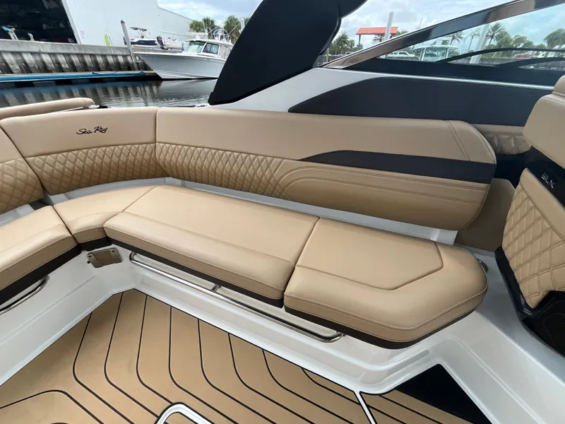 Slide: The Image of The 2027 Sea Ray SLX 280 Outboard features luxurious beige upholstery with a quilted design. - 19