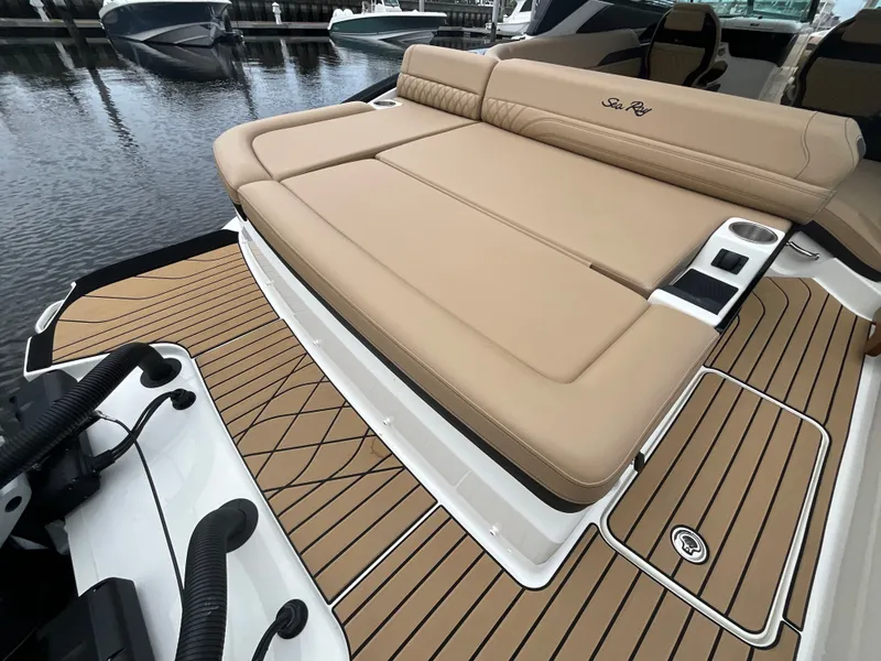 Slide: The Image of The image shows the deck of a 2027 Sea Ray SLX 280 Outboard with beige upholstery. - 15