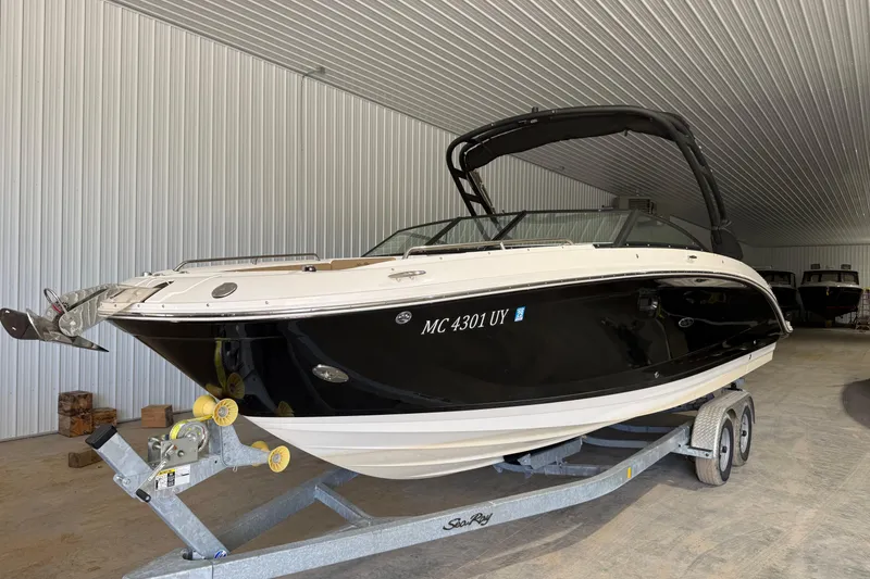 Slide: The Image of 2023 Sea Ray SDX 290 boat on trailer in indoor storage facility. - 0